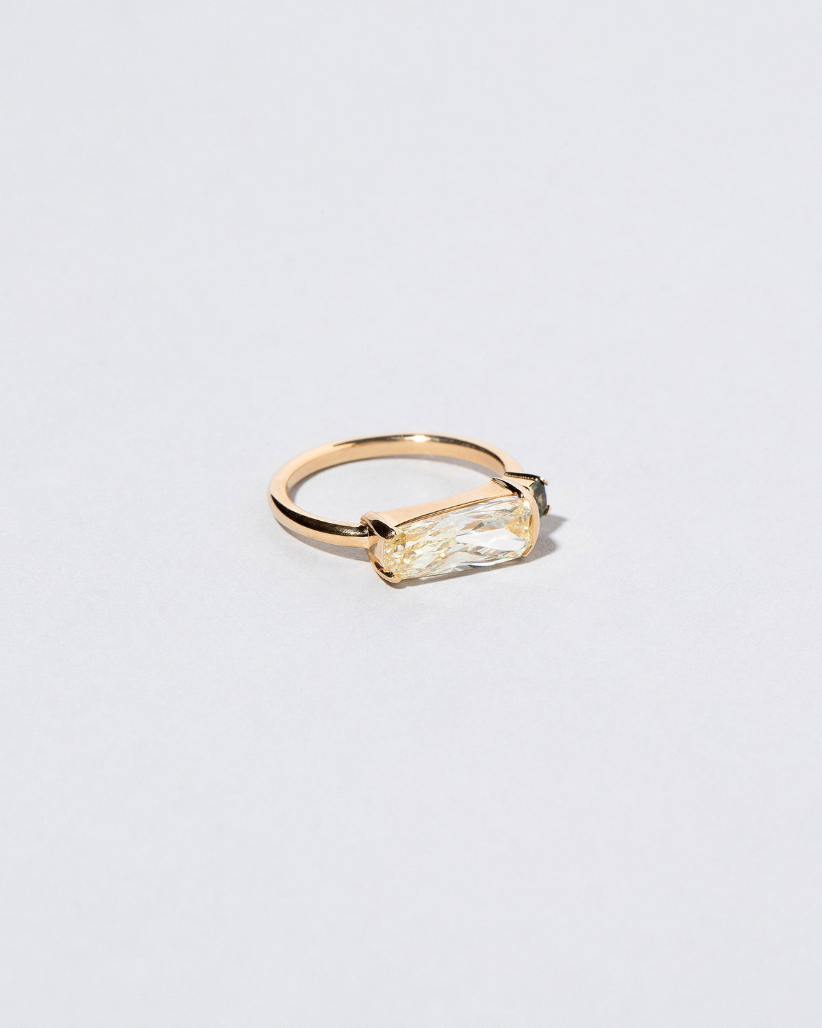  Immanence Ring on light color background.