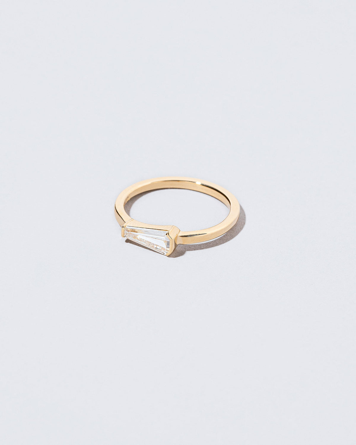 View from the side of the Niphredil Ring on light color background.