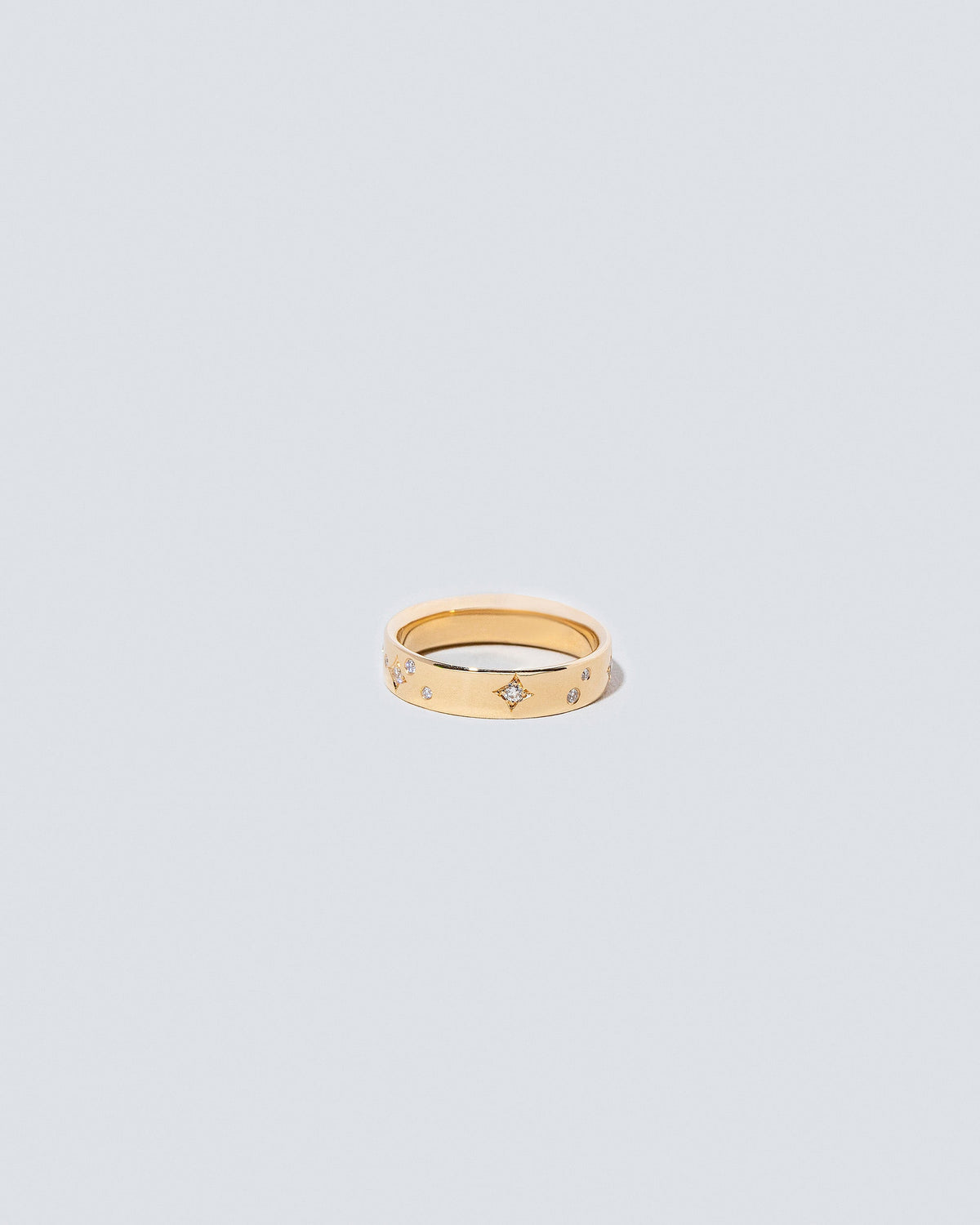 Gold 4mm Square Wire Band with Little Array White Diamonds added on light color background.