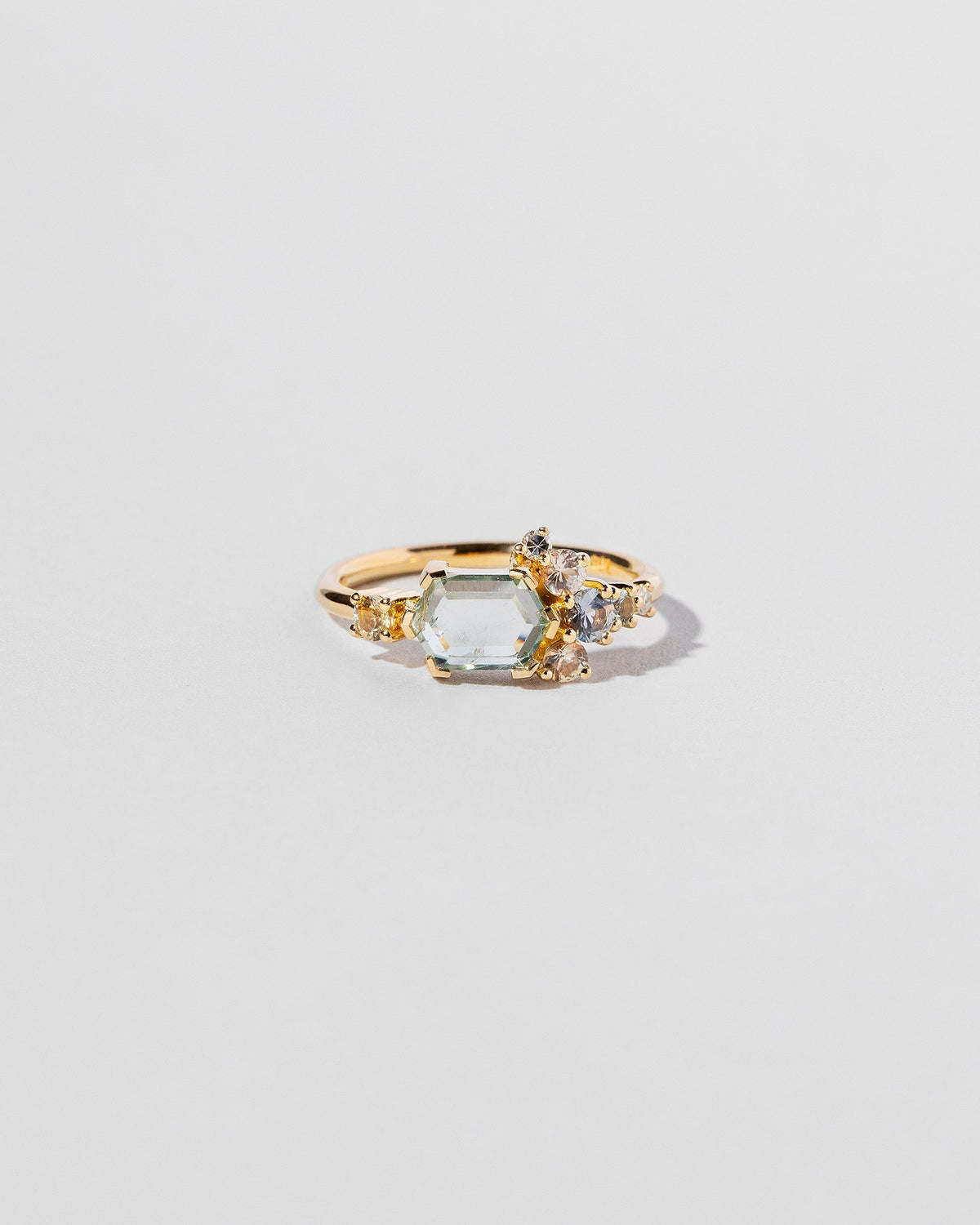  Hexagonal Slice Sapphire Cluster Ring on light color background.