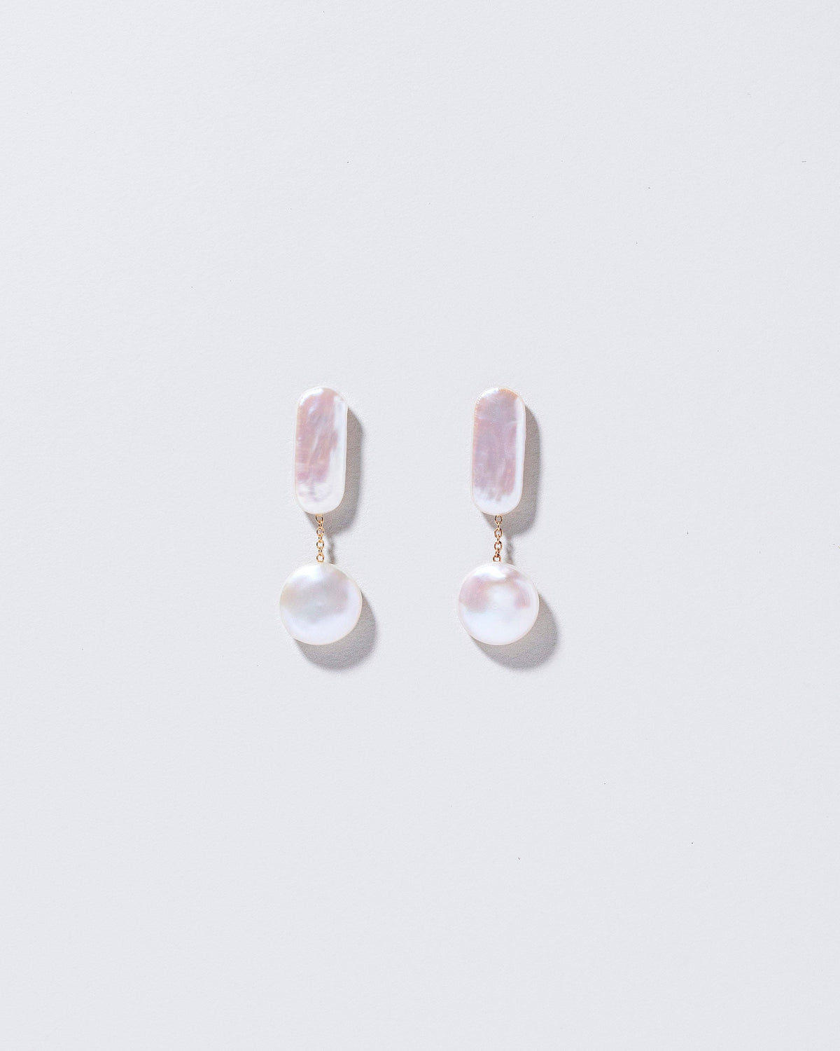 Polyphemus Earrings on light color background.