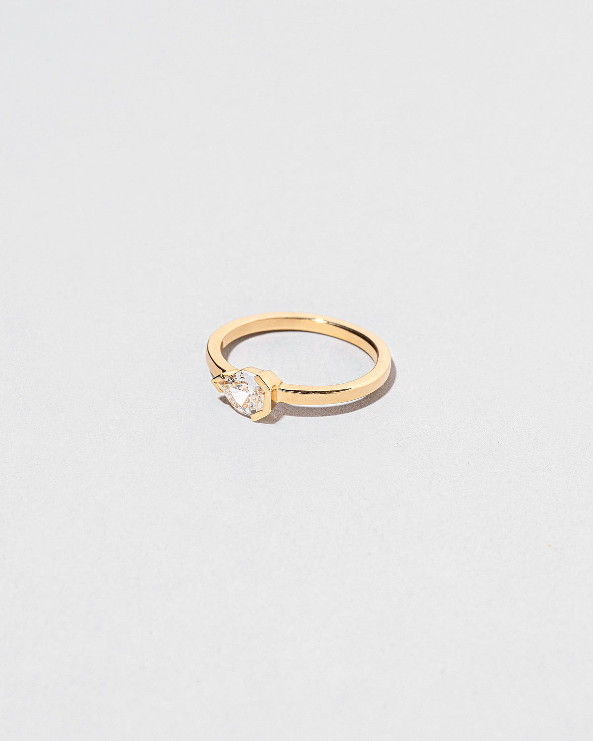 View from the side of the Serenna Ring on light color background.