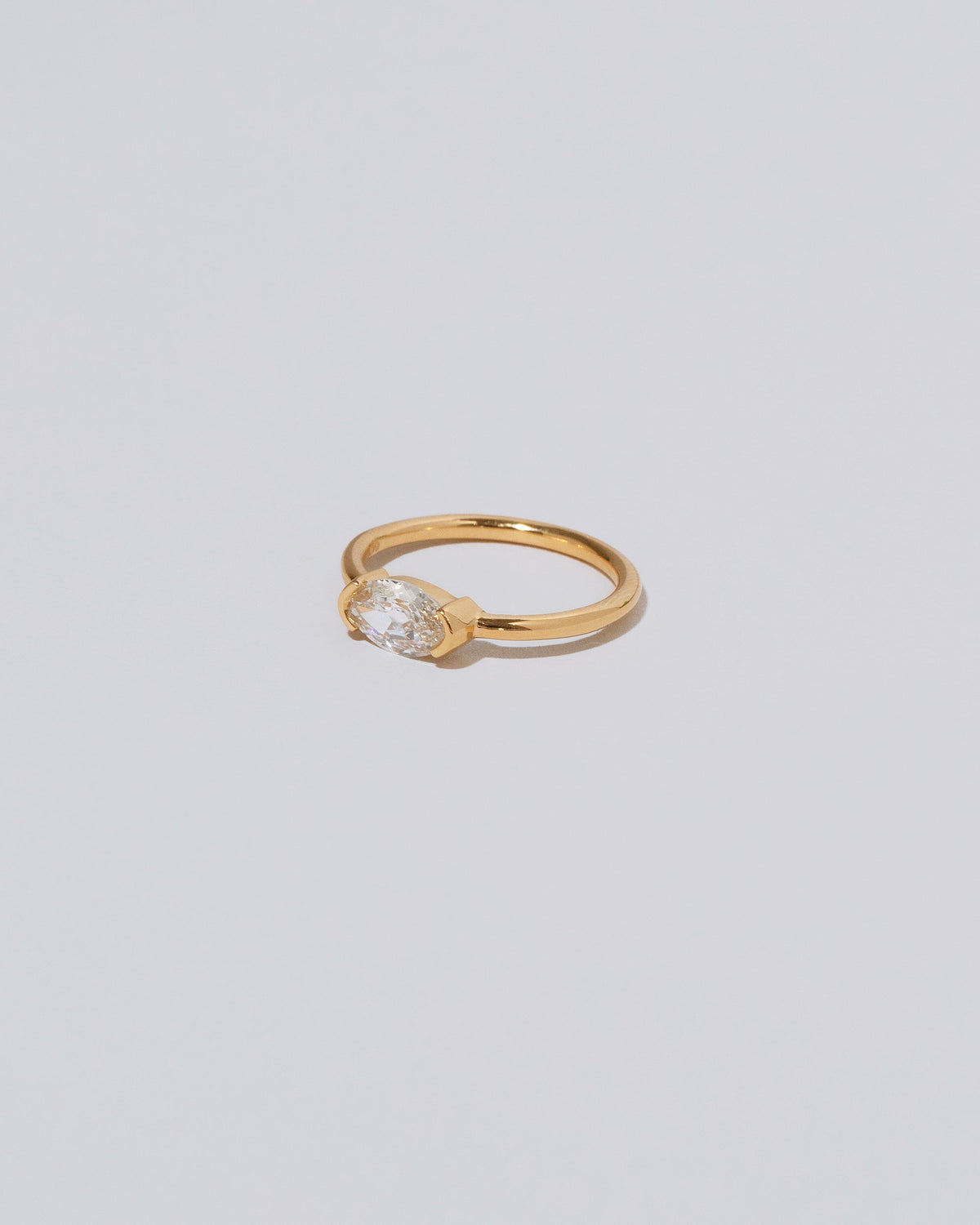 View from the side of the De Coté Ring on light color background.