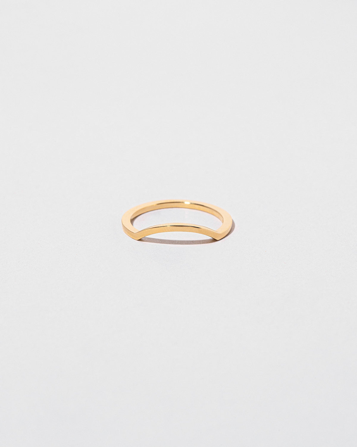 Gold Square Wire Mini Curve Band on light color background.