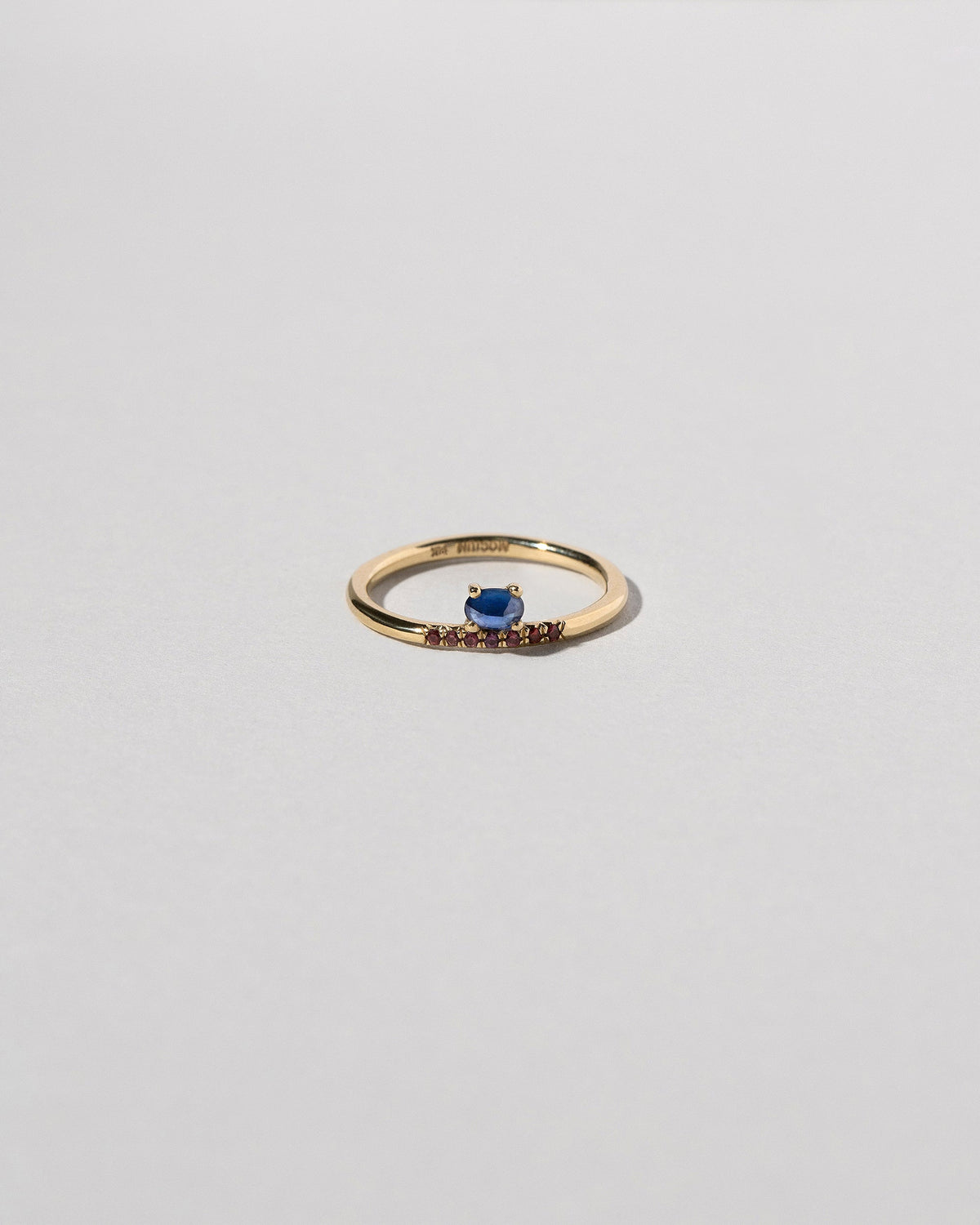  Stacked Ring - Sapphire & Ant Hill Garnet on light color background.