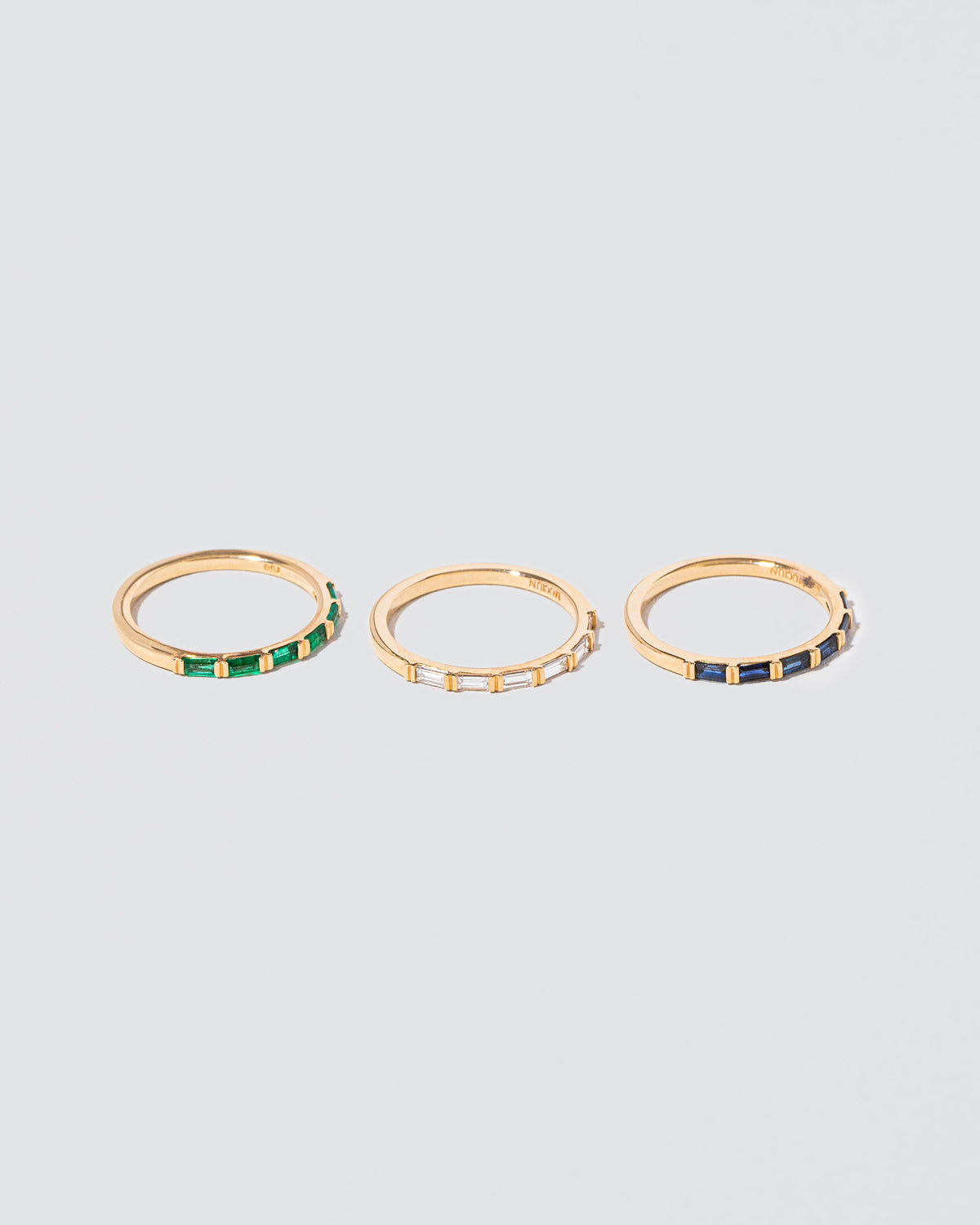 Gold Bar Baguette Bands on light color background.