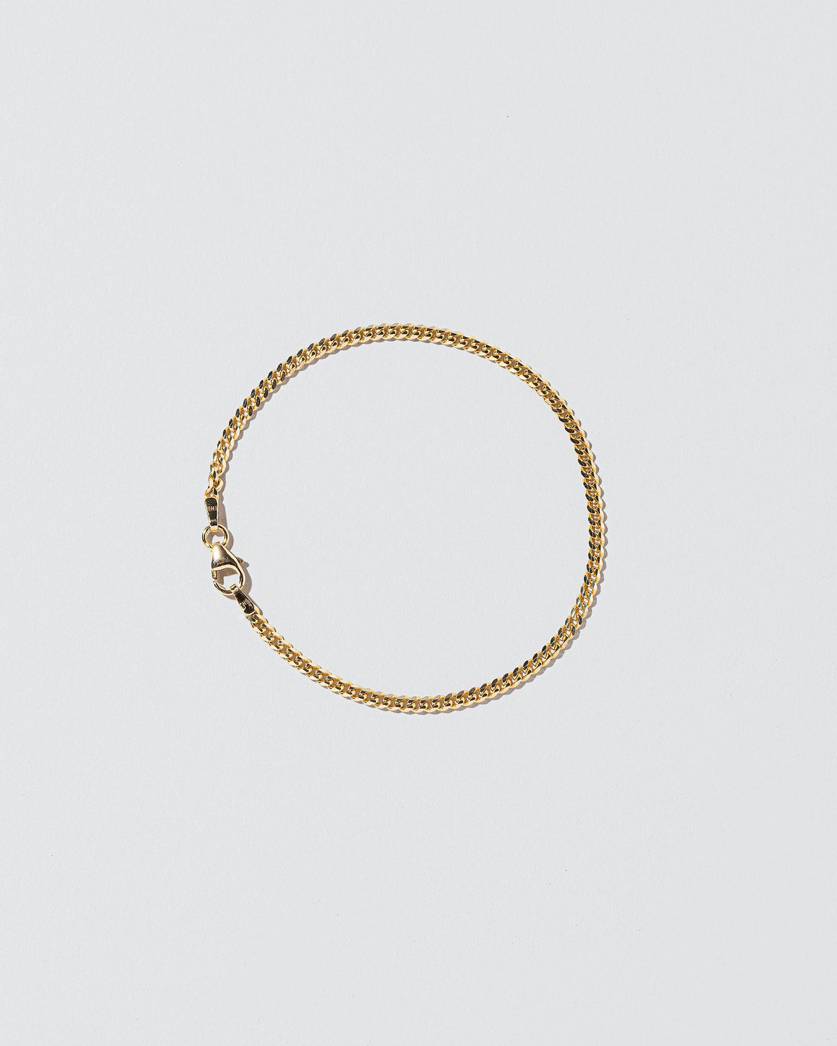 2.4mm Curb Chain Bracelet on light color background.