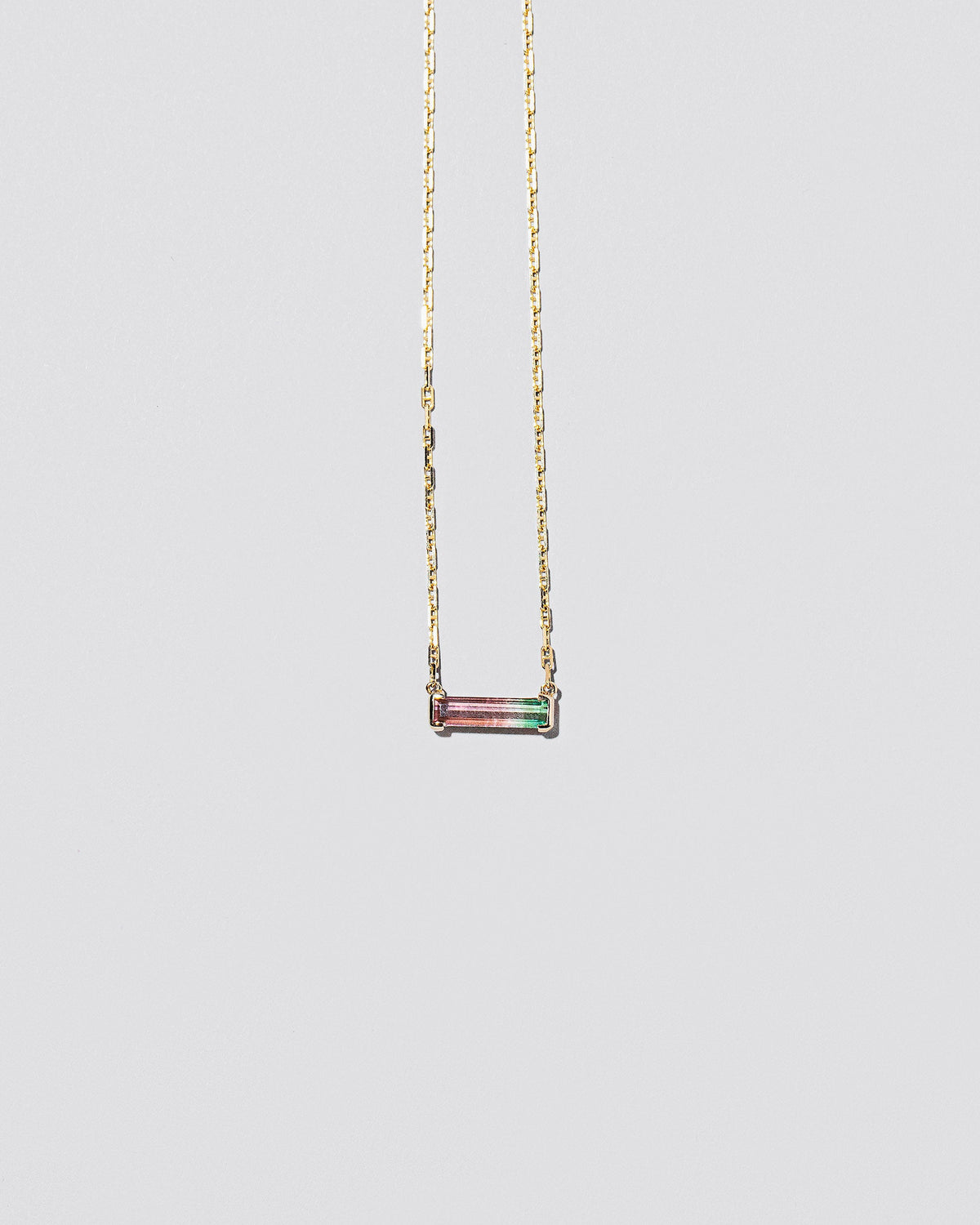  Kiss Me Necklace on light color background.