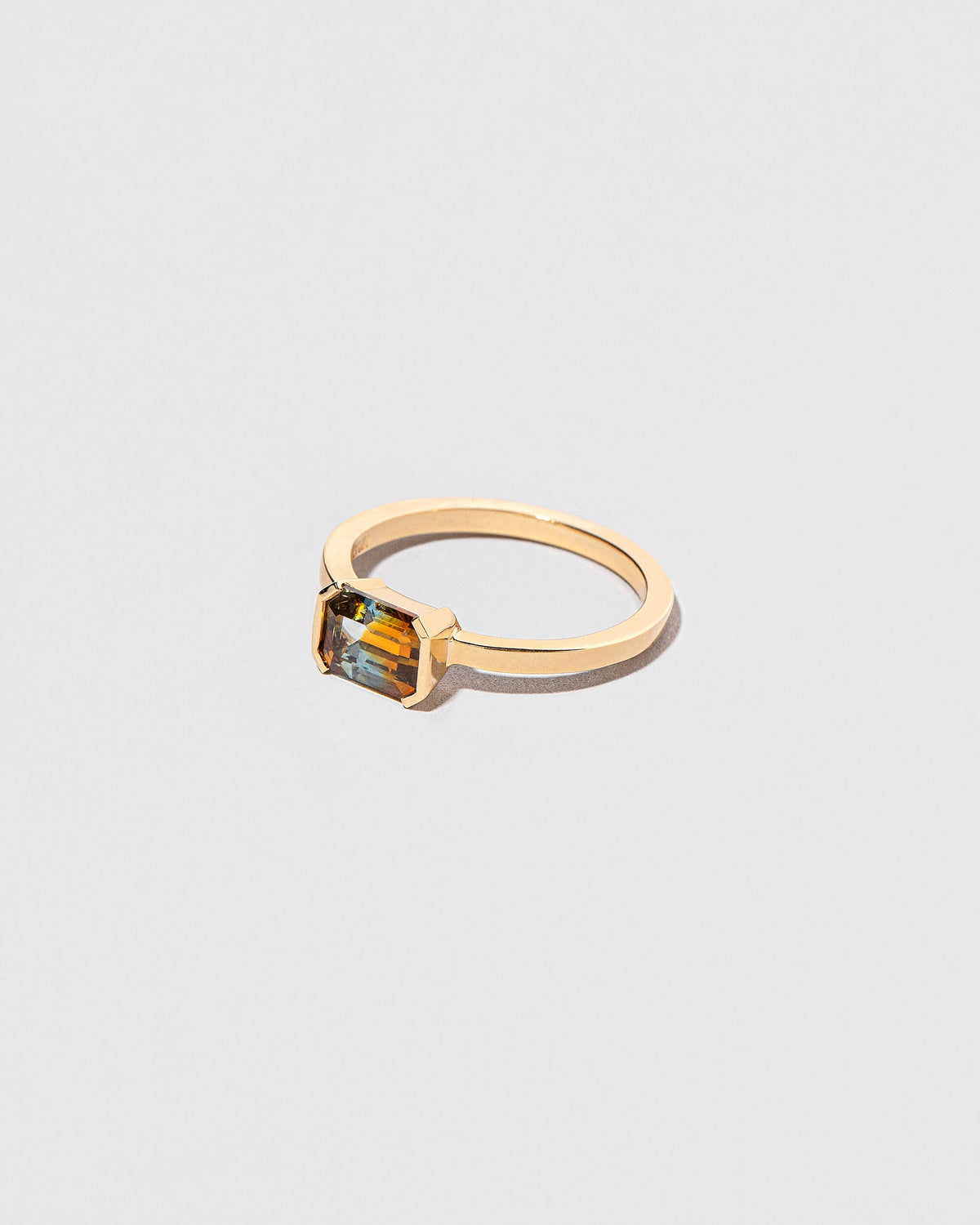View from the side of the Elowan Ring on light color background.