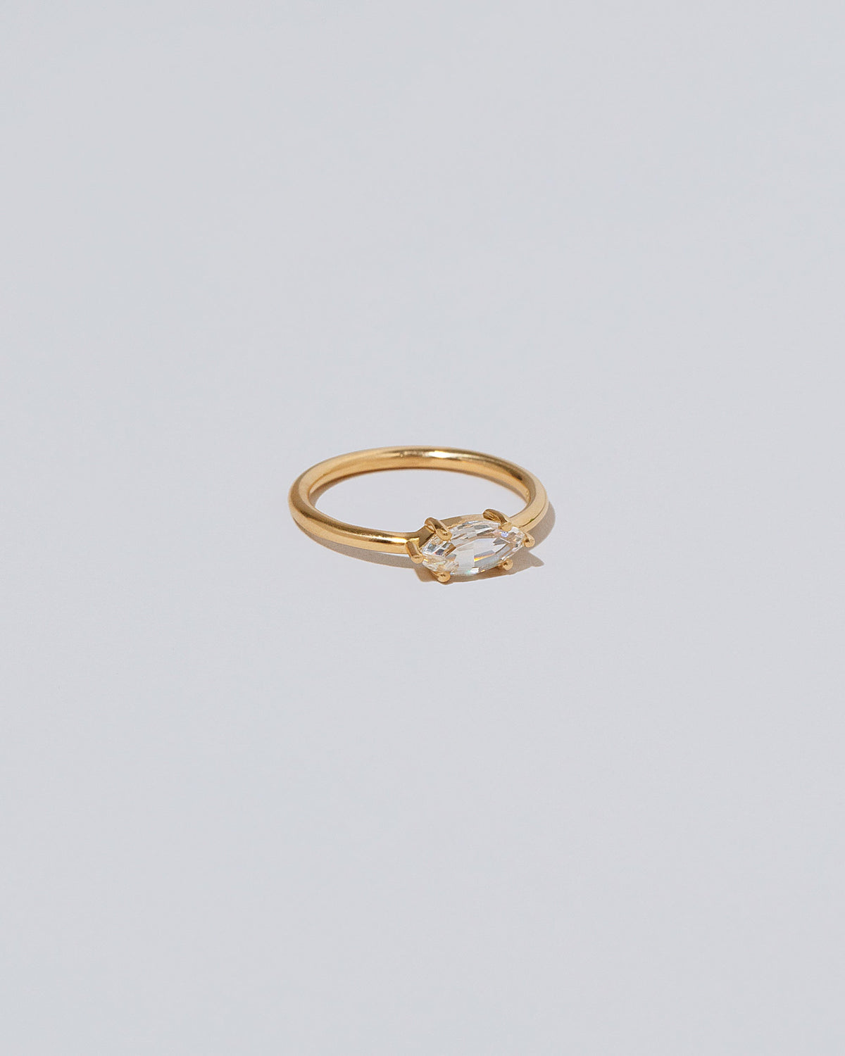 View from the side of the Ouvert Ring on light color background.